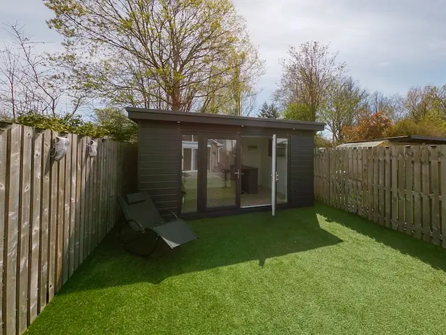 Timber garden room in a landscaped backyard