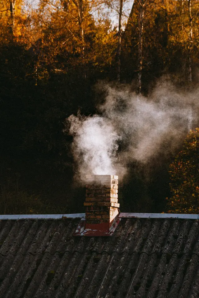 Smoke rising from a swept chimney