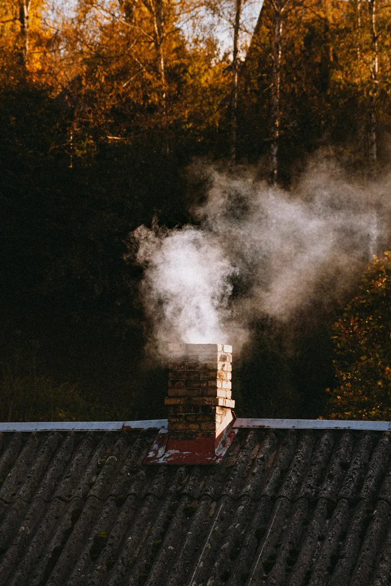 Smoke rising from a swept chimney