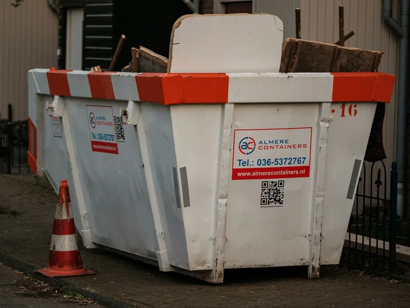 Mini skip filled with renovation waste
