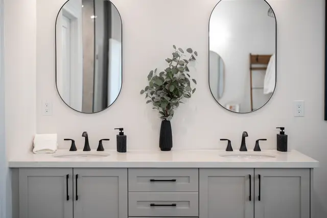 Bathroom vanity with double sinks and mirrors