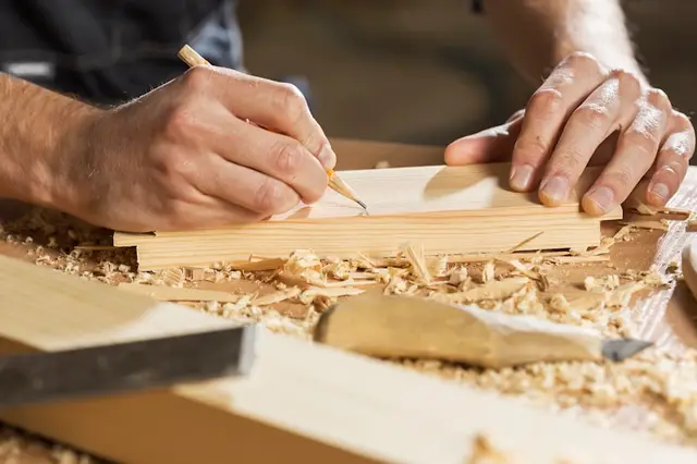 Joiner preparing timber for kitchen units
