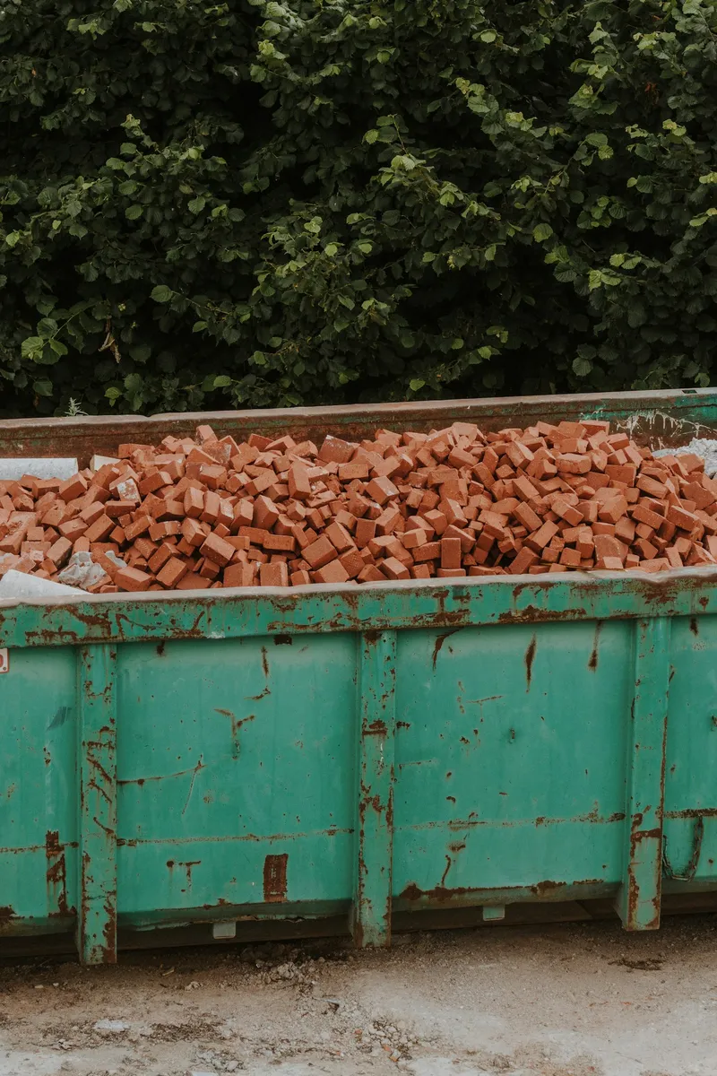 Skip loaded with brick and rubble