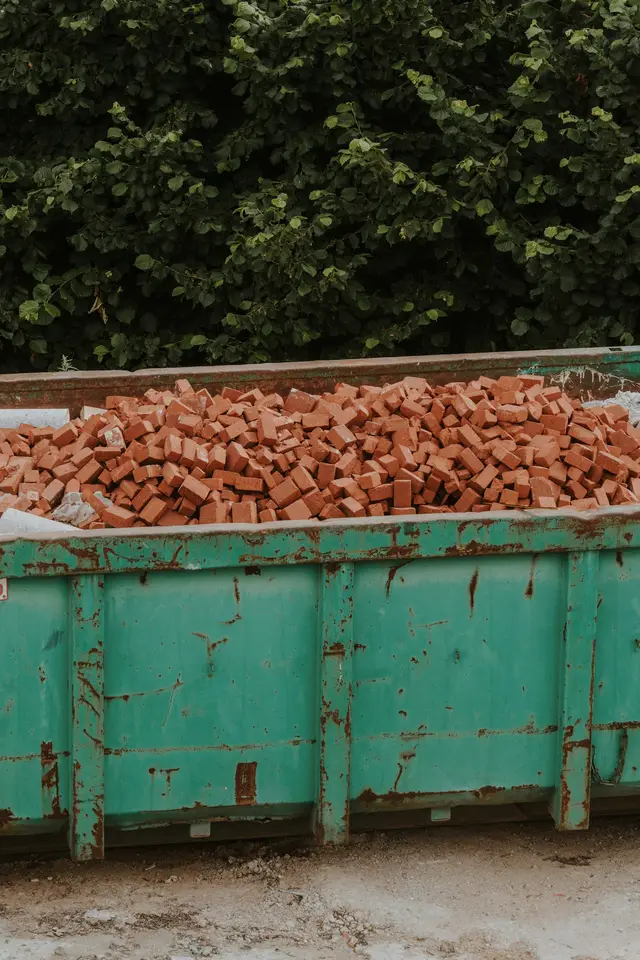 Skip loaded with brick and rubble