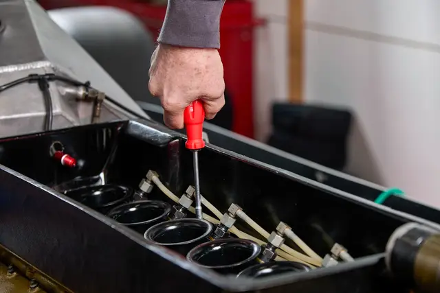 Mechanic repairing a car engine