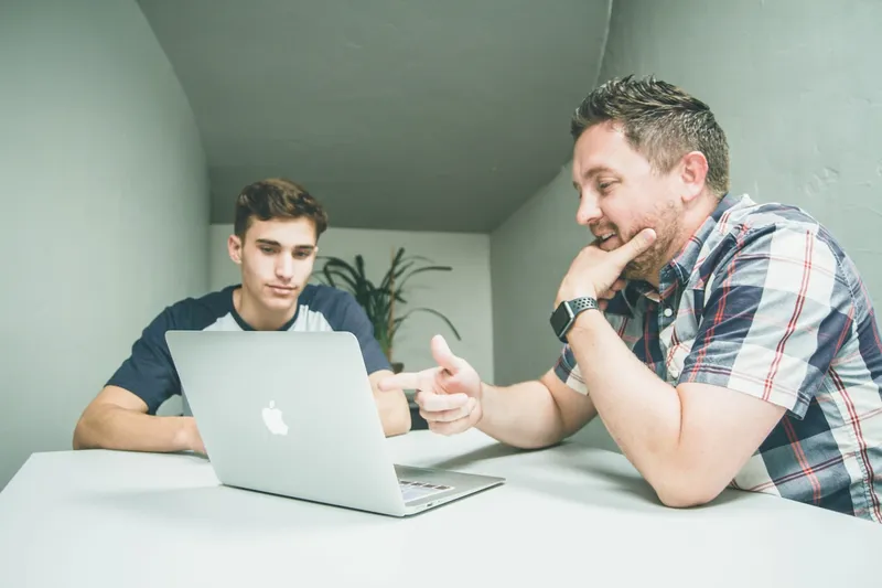A-Level student studying with a tutor